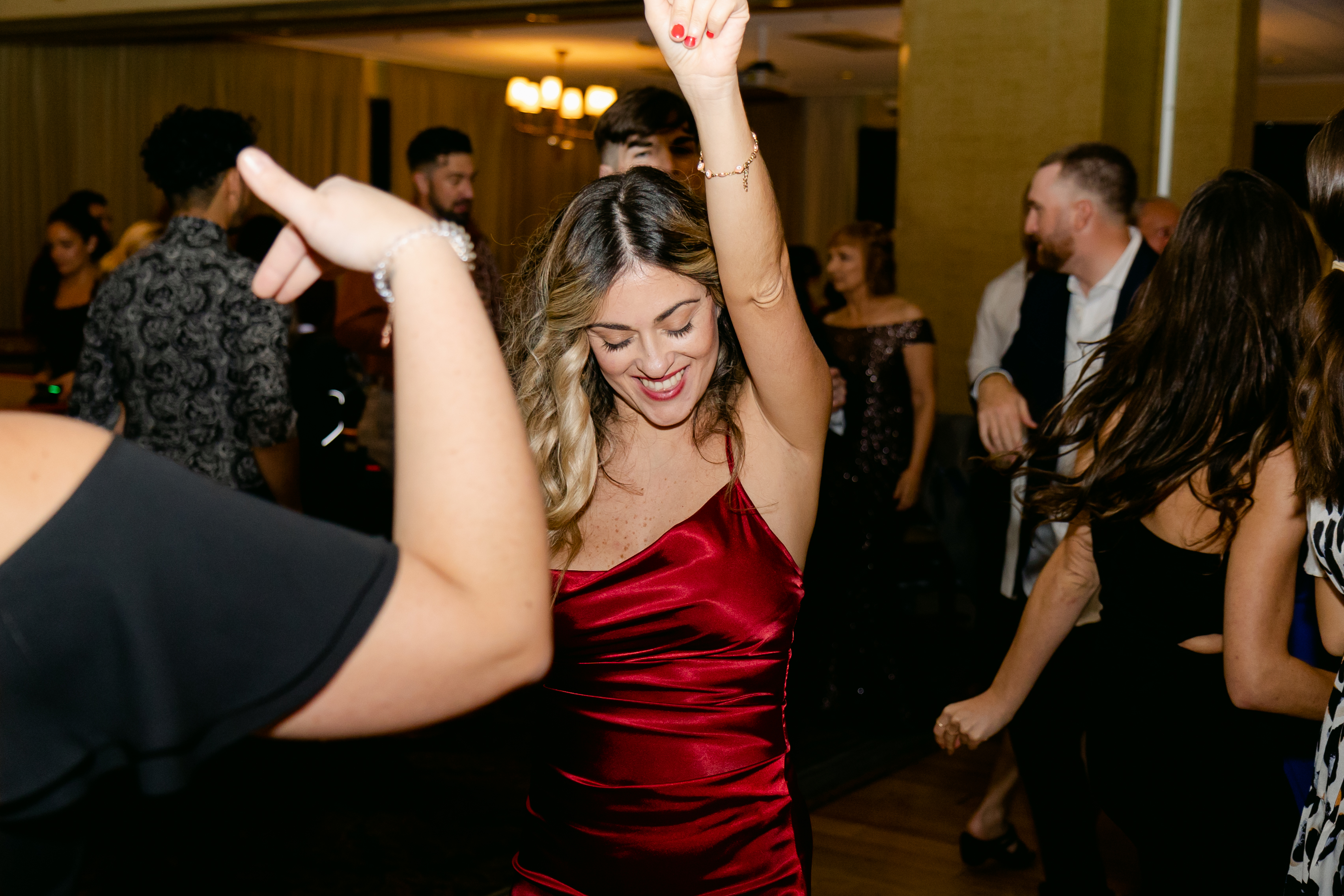Groom hitting the dab surrounded by cheering groomsmen