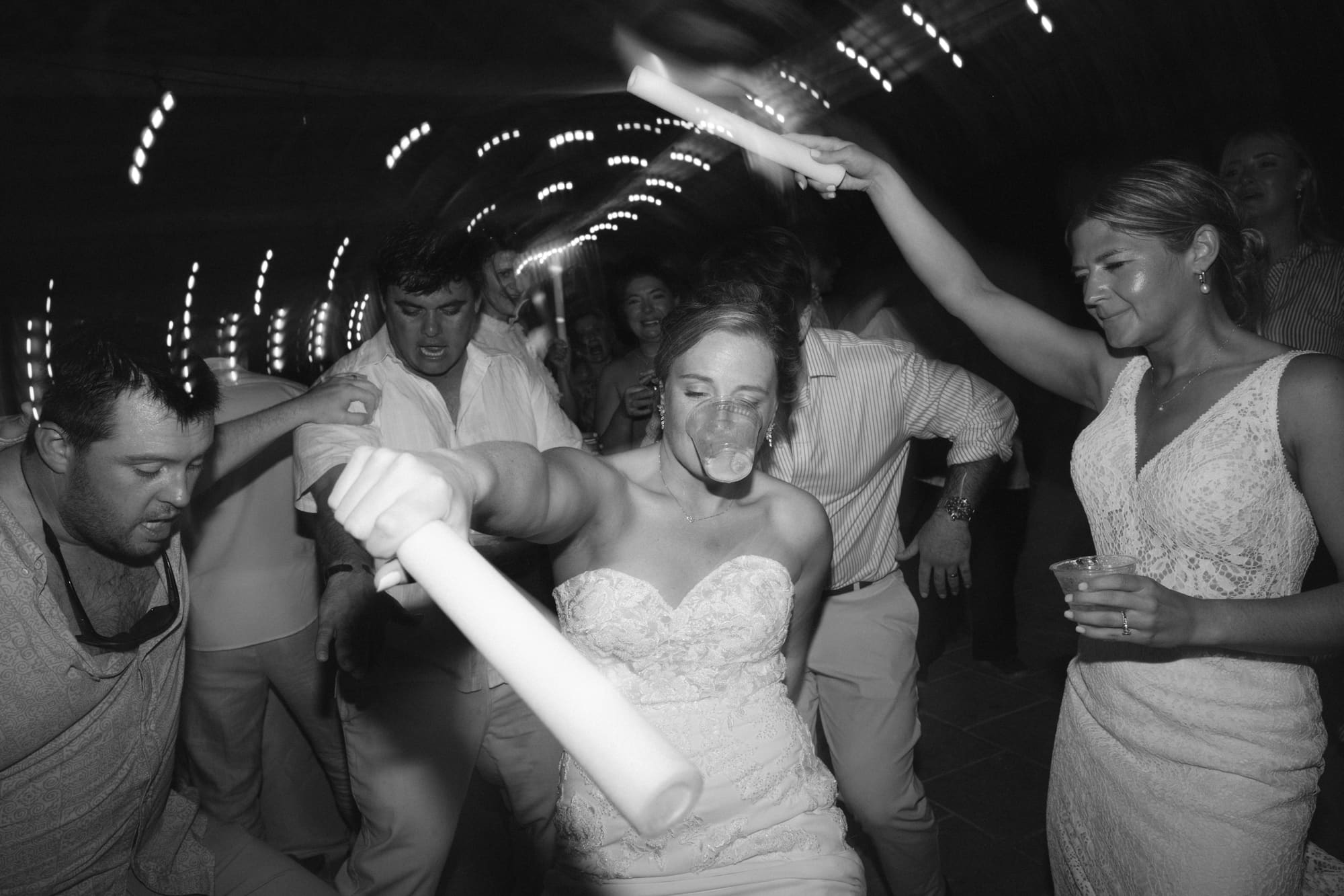 Wedding guests dancing in a foam party celebration
