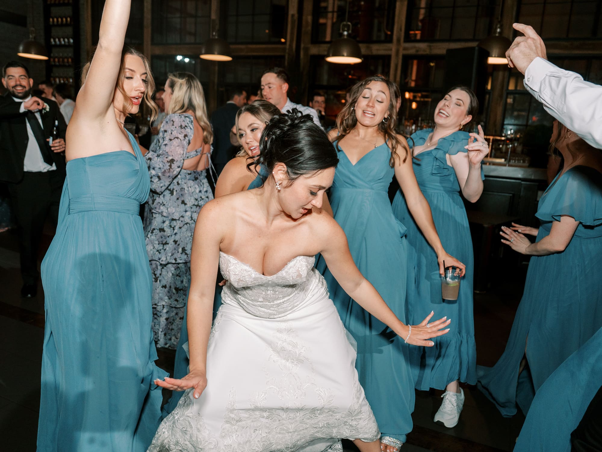 Bridesmaids cheering during a Modern Era Weddings reception
