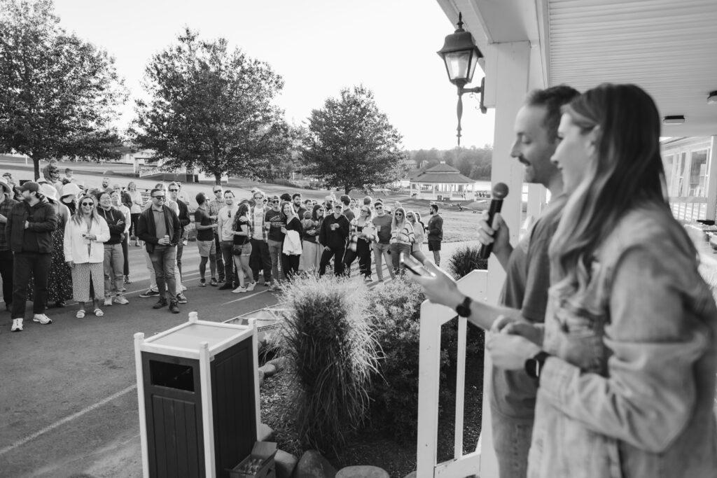 Guests dancing as synchronized lighting transforms the reception space